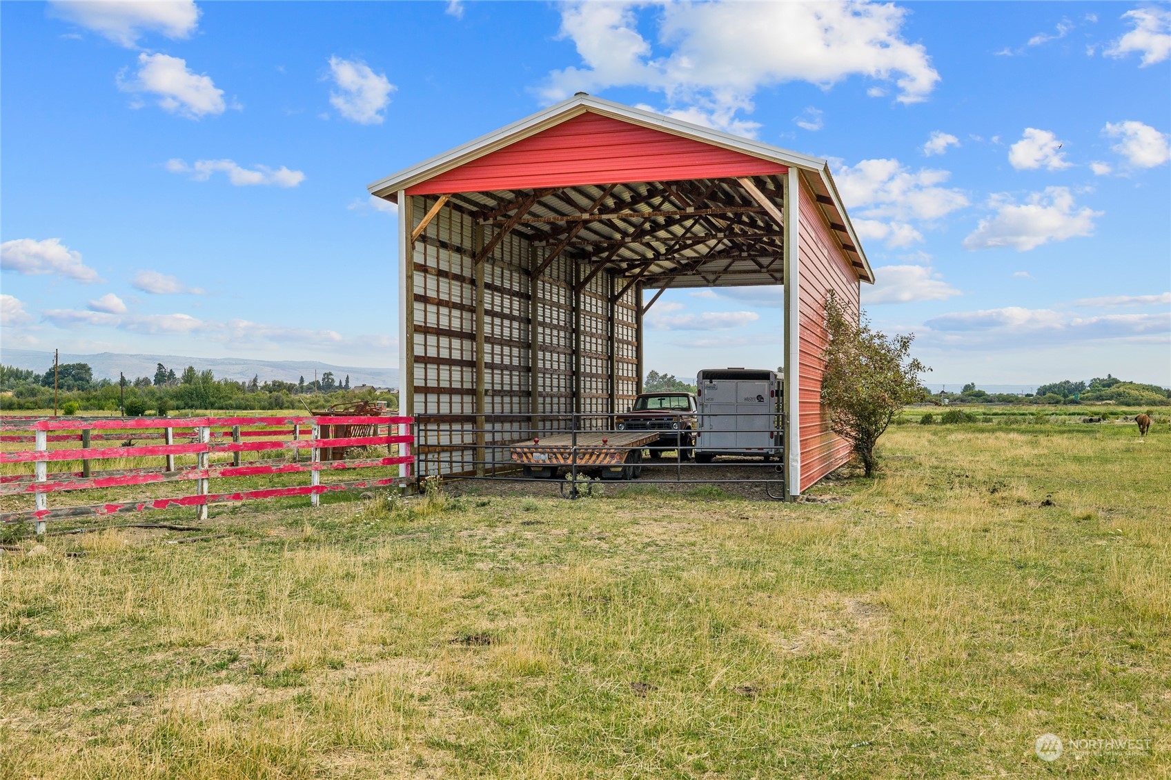 720 Klocke Road Ellensburg, WA 98926 - Photo 35 of 40 a view of a wooden house with a big yard and large trees
