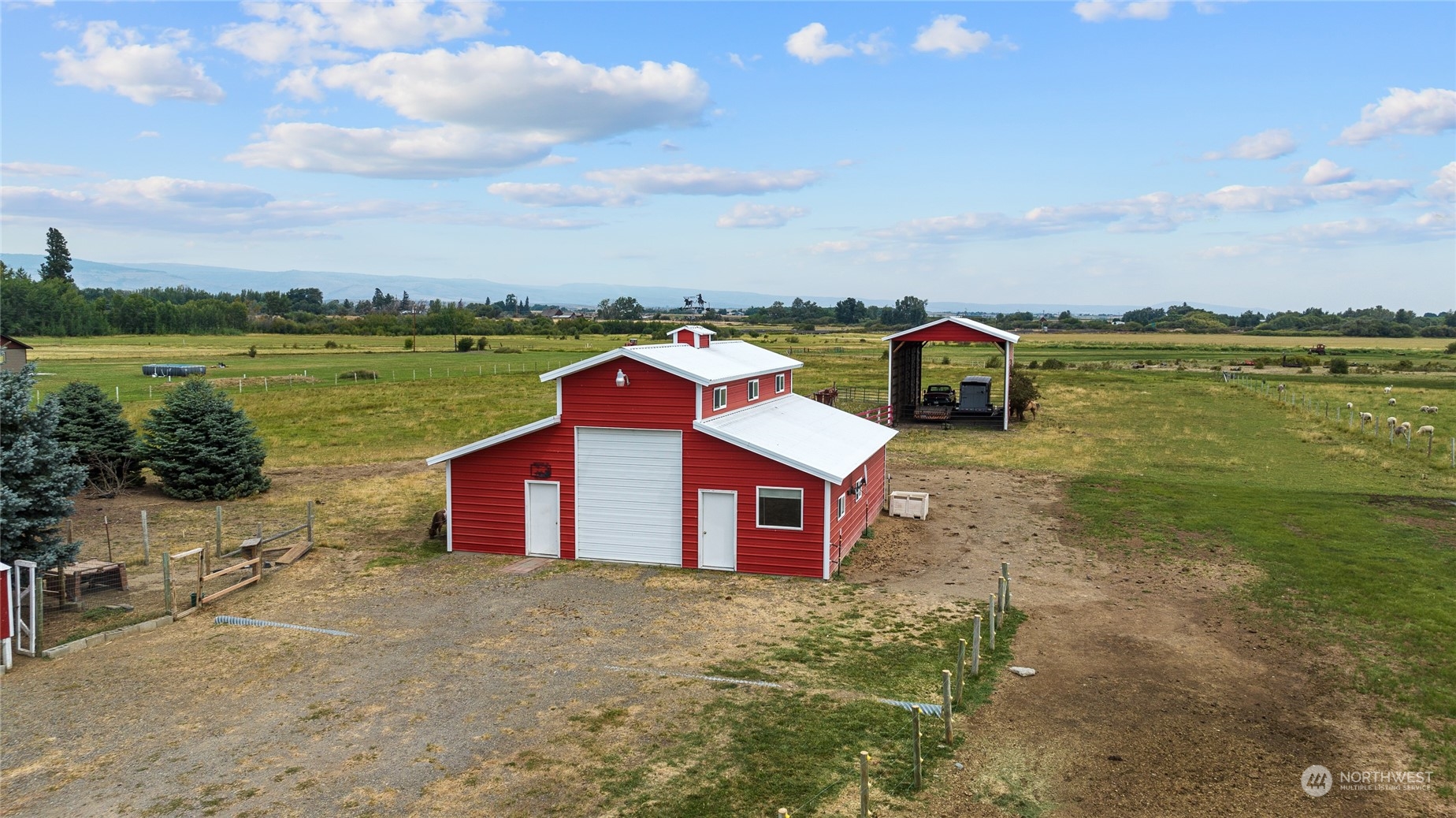 720 Klocke Road Ellensburg, WA 98926 - Photo 36 of 40 a aerial view of a house with a yard and lake view