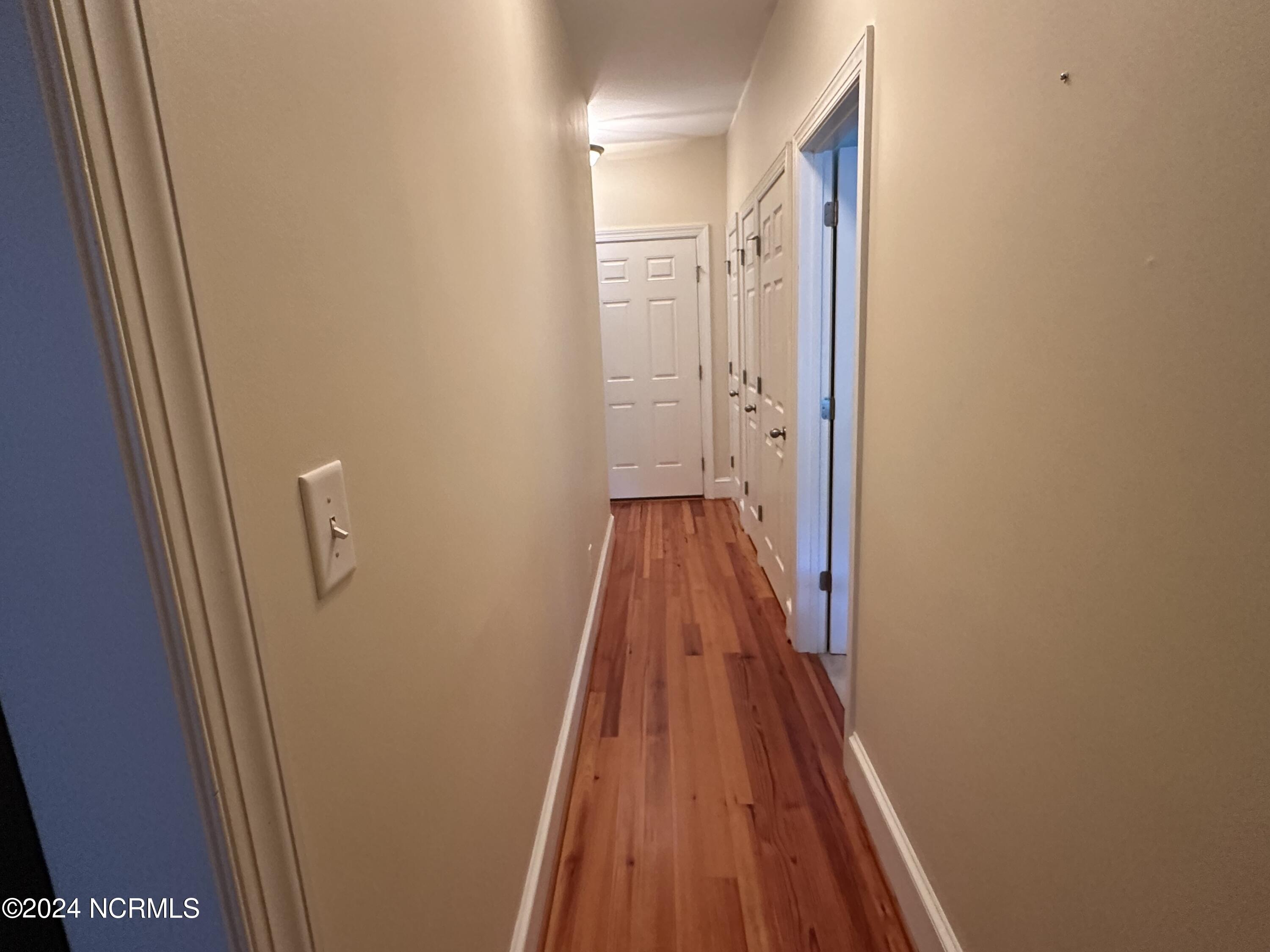 1129 Bennett Road, Unit 1A Minnesott Beach, NC 28510 - Photo 15 of 35 The bedrooms are divided by the hallway