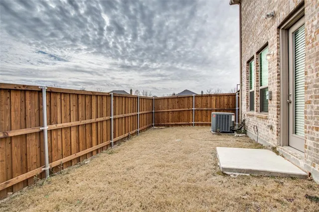 a view of backyard with seating space