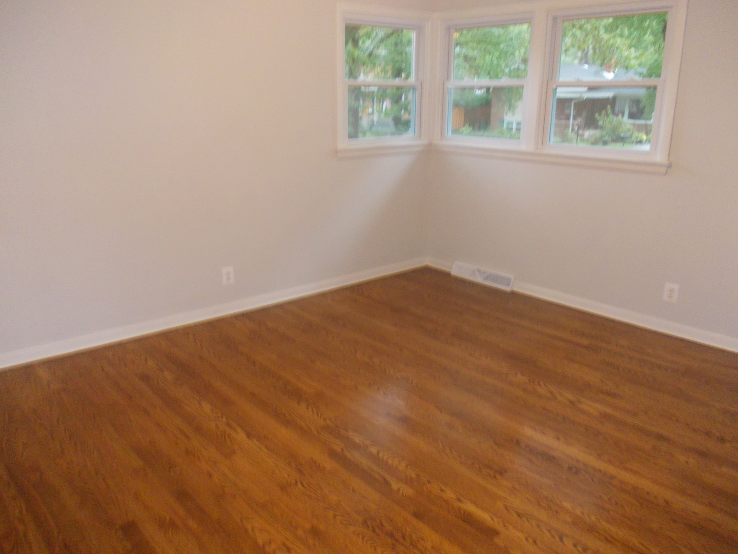 1418 Hillview Road Homewood, IL 60430 - Photo 14 of 19 an empty room with wooden floor and windows