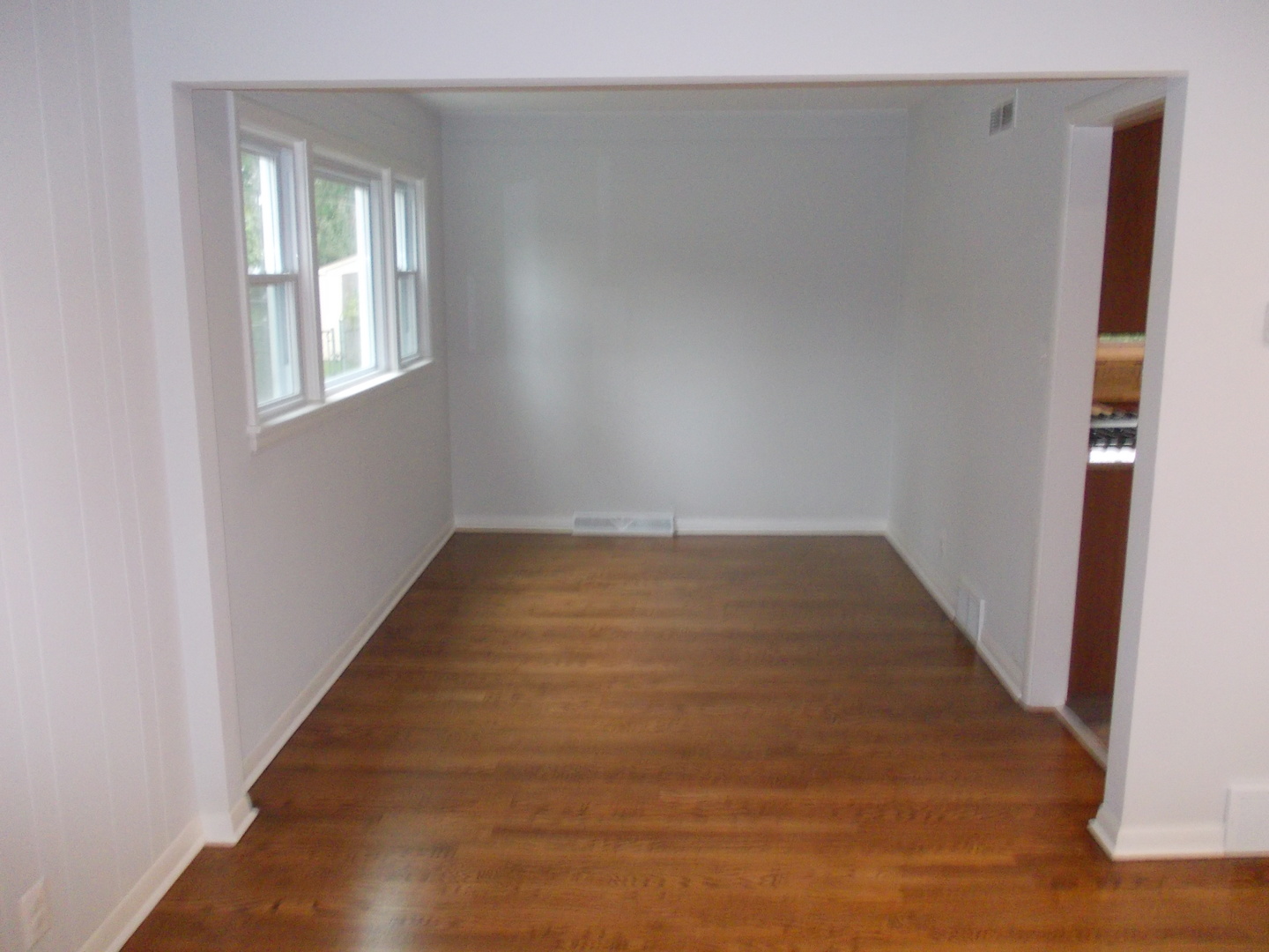 1418 Hillview Road Homewood, IL 60430 - Photo 4 of 19 an empty room with wooden floor and windows