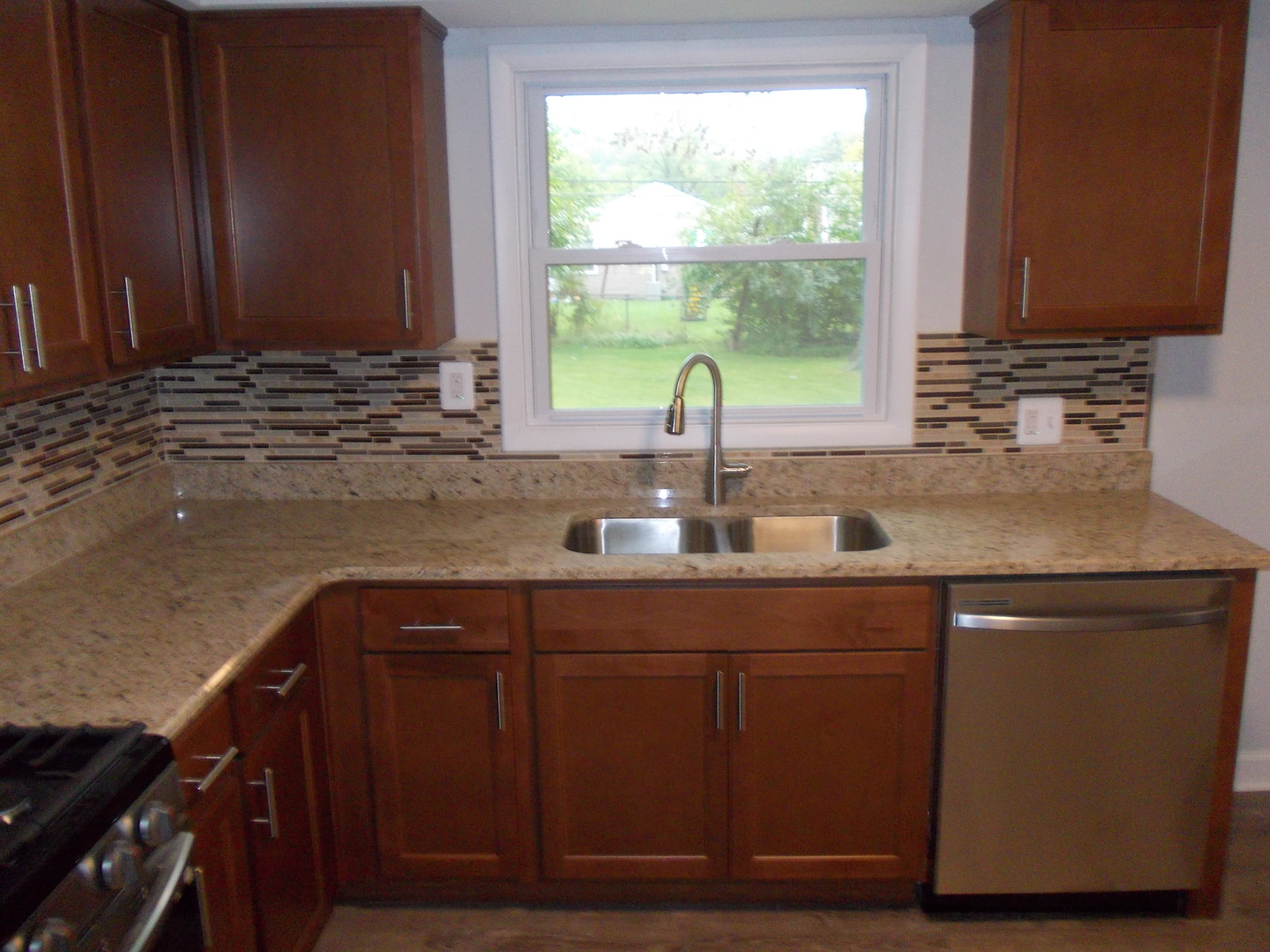 1418 Hillview Road Homewood, IL 60430 - Photo 5 of 19 a kitchen with a sink and wooden cabinets