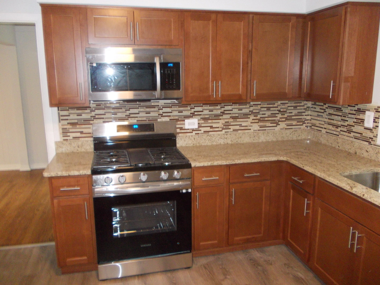 1418 Hillview Road Homewood, IL 60430 - Photo 6 of 19 a stove top oven sitting inside of a kitchen
