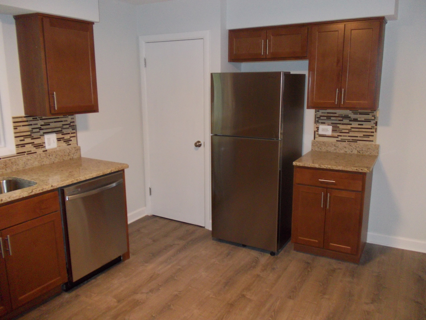 1418 Hillview Road Homewood, IL 60430 - Photo 8 of 19 a kitchen with stainless steel appliances granite countertop a refrigerator and a stove top oven