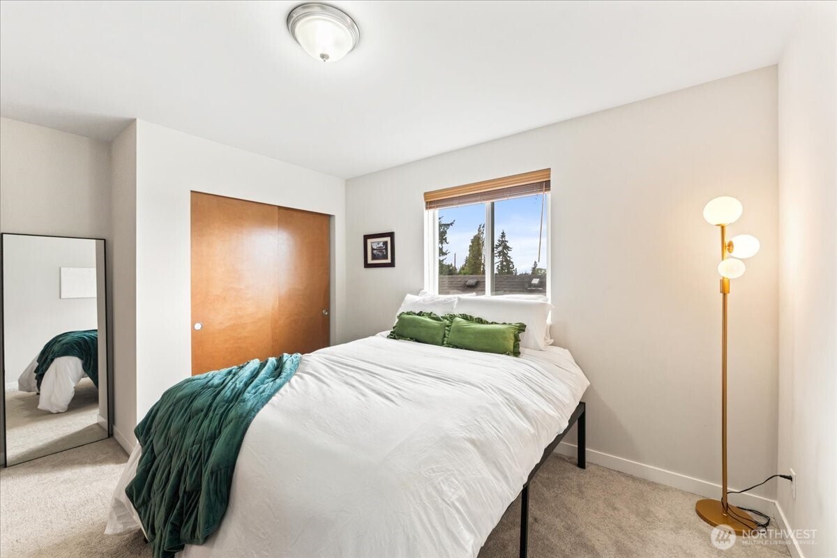 12418 2nd Place Southwest Burien, WA 98146 - Photo 17 of 39 a bedroom with a bed and a table