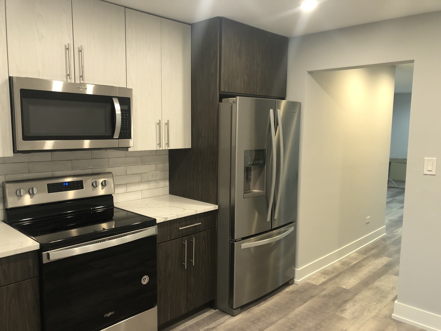 2243 West Nichols Road, Unit C Arlington Heights, IL 60004 - Photo 3 of 10 a kitchen with a refrigerator stove and microwave