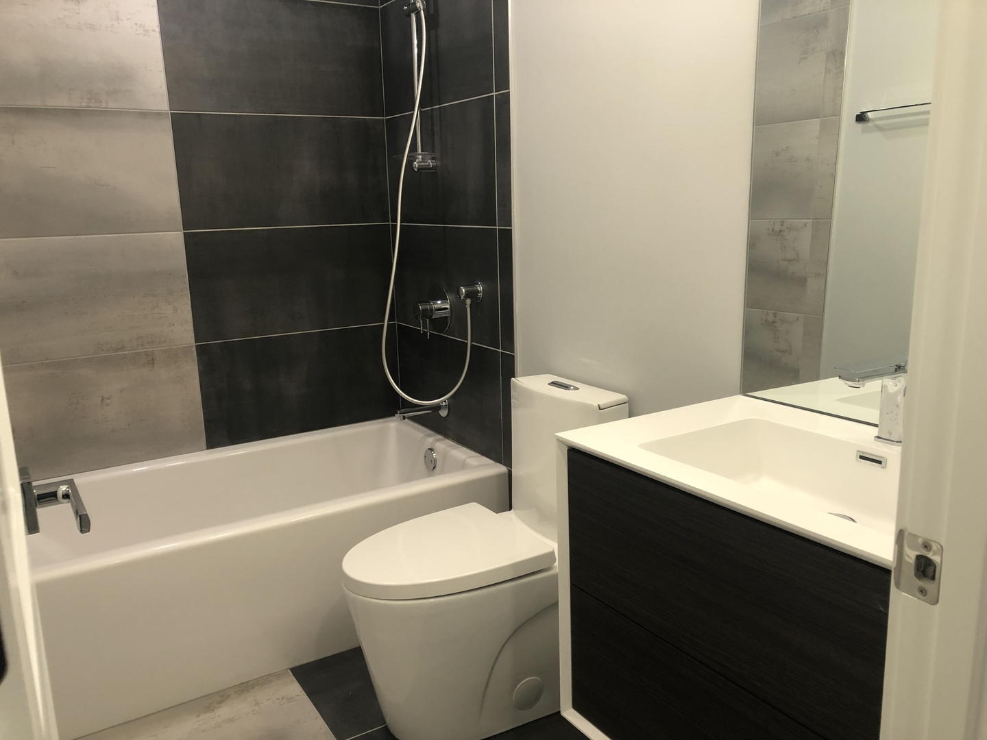 2243 West Nichols Road, Unit C Arlington Heights, IL 60004 - Photo 5 of 10 a bathroom with a sink a toilet and a bathtub