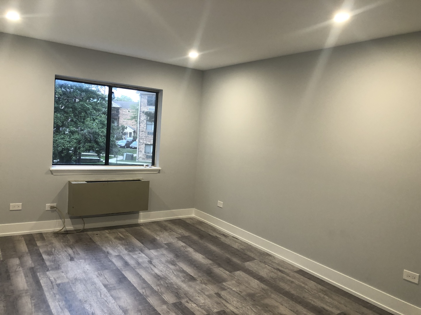 2243 West Nichols Road, Unit C Arlington Heights, IL 60004 - Photo 8 of 10 an empty room with a window
