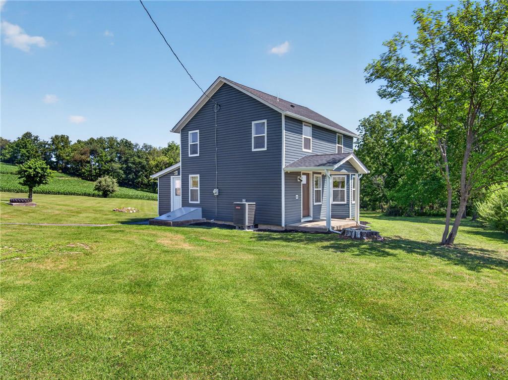 291 East Dannersville Road Bath, PA 18014 - Photo 5 of 46 A classic two-story home, freshly sided, stands amidst a verdant lawn, offering quiet country living.