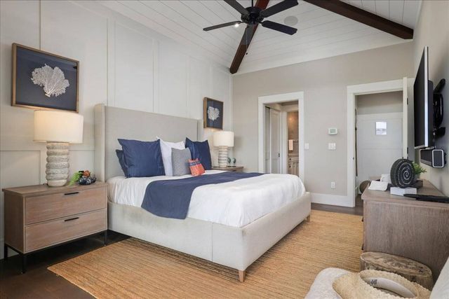 a kitchen with kitchen island a table and chairs in it