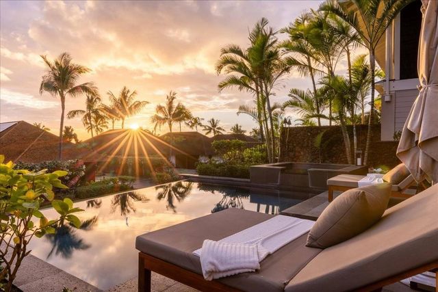 a terrace with outdoor seating and city view