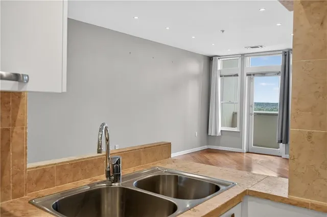 a kitchen with a sink and a refrigerator