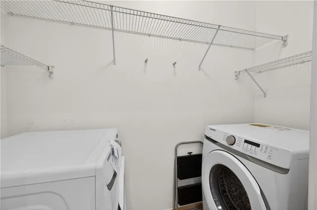 a utility room with dryer and washer