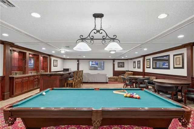 a view of a room with furniture and a chandelier