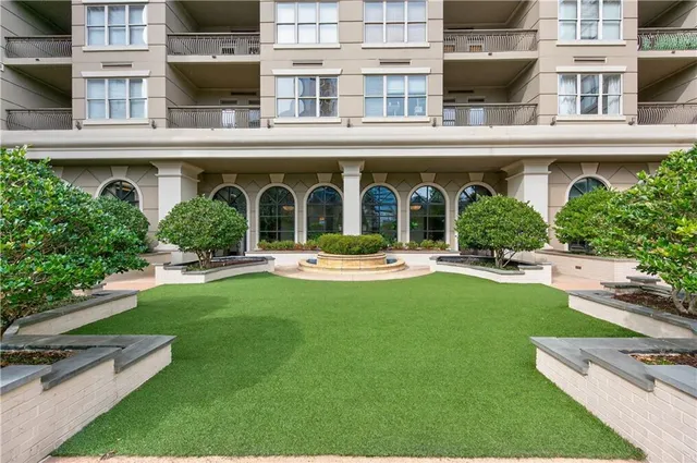 a view of building with outdoor space and swimming pool
