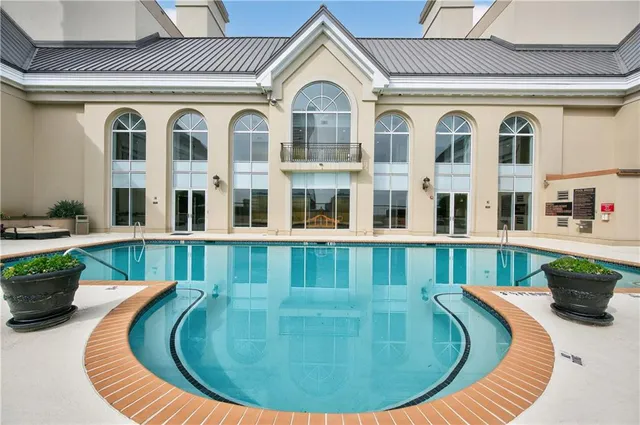 a view of a brick house with windows and wooden floor