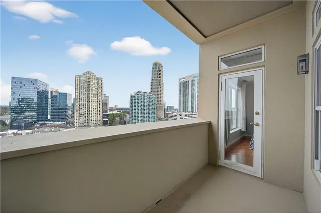 a view of a living room with a large window