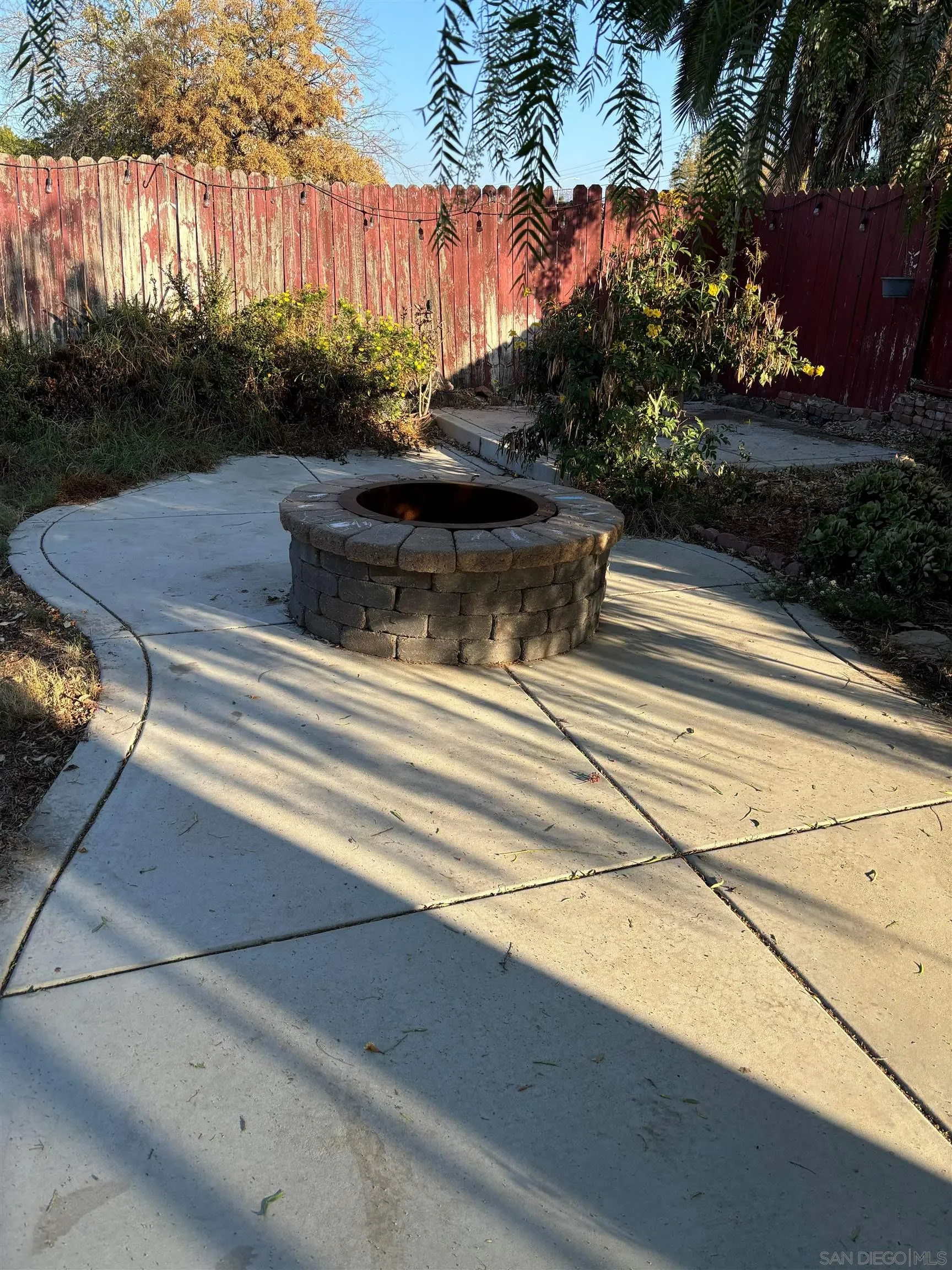 10011 Tamil Road Lakeside, CA 92040 - Photo 12 of 14 a view of a swimming pool with a bench in front of house