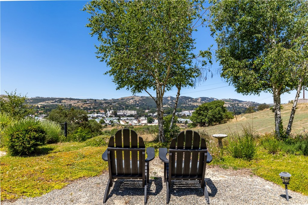 669 Red Cloud Road Paso Robles, CA 93446 - Photo 2 of 61 a view of a chair and table on the wooden floor next to a yard