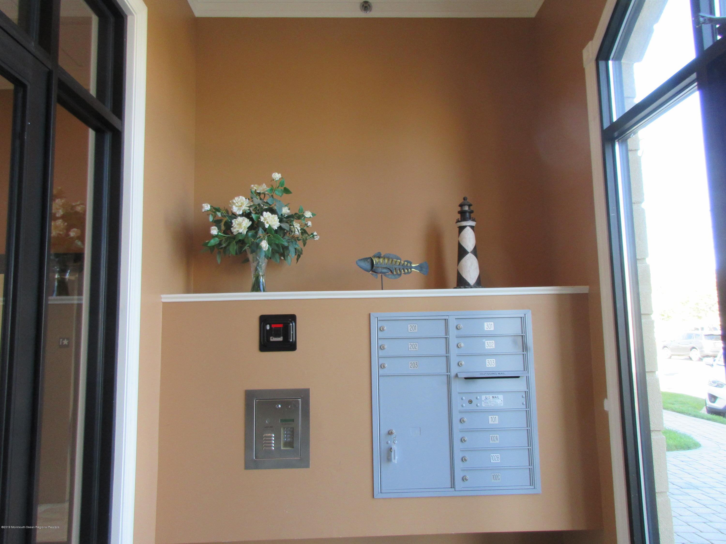 701 Main Street, Unit 301 Belmar, NJ 07719 - Photo 3 of 13 a bathroom with a sink a mirror and a window
