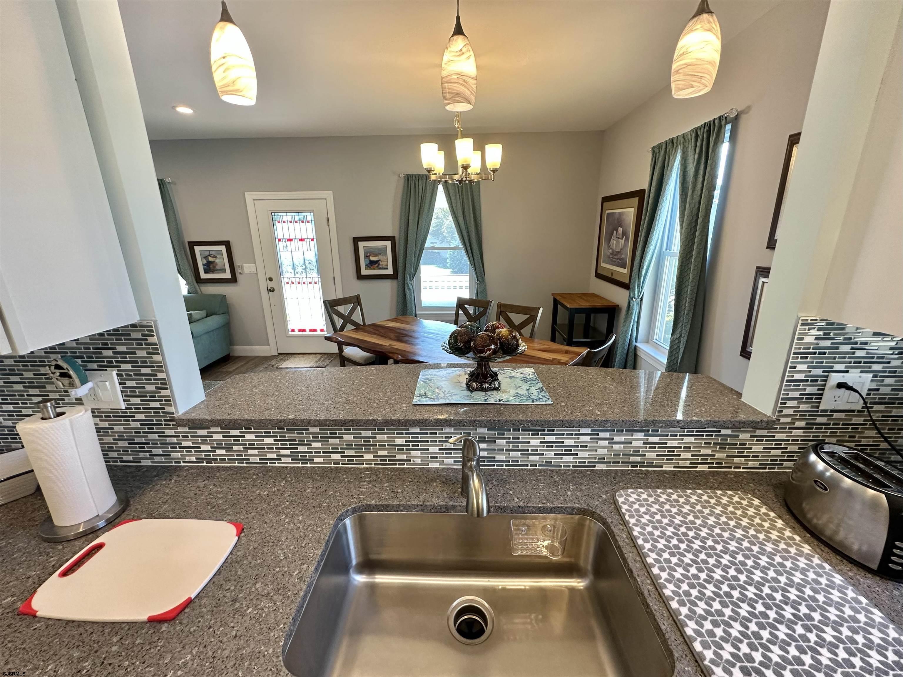 201 19th Street South Brigantine, NJ 08203 - Photo 11 of 29 a bathroom with a sink and a mirror