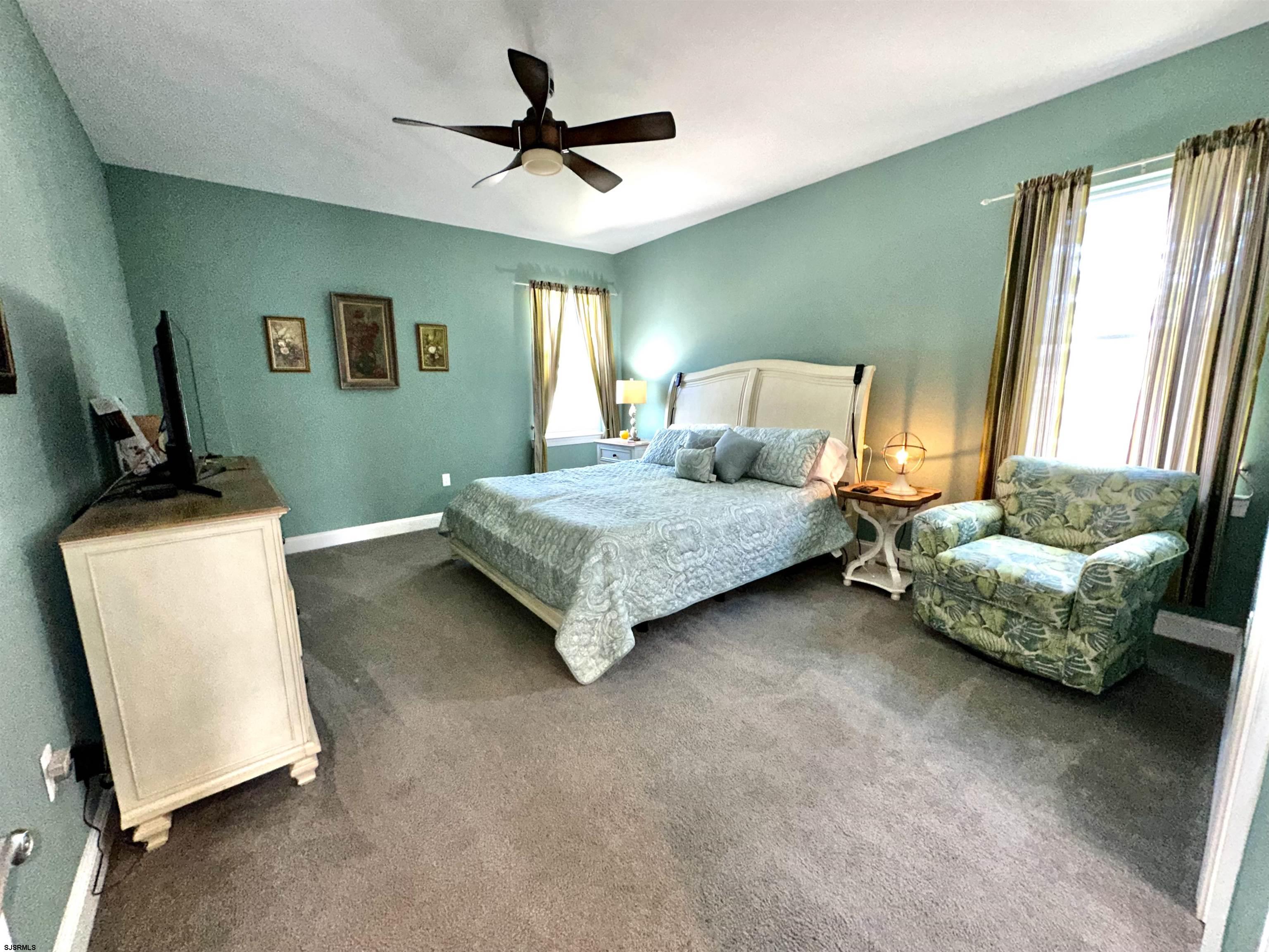 201 19th Street South Brigantine, NJ 08203 - Photo 12 of 29 a bedroom with a bed and a couch