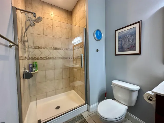 a white toilet sitting next to a bathroom