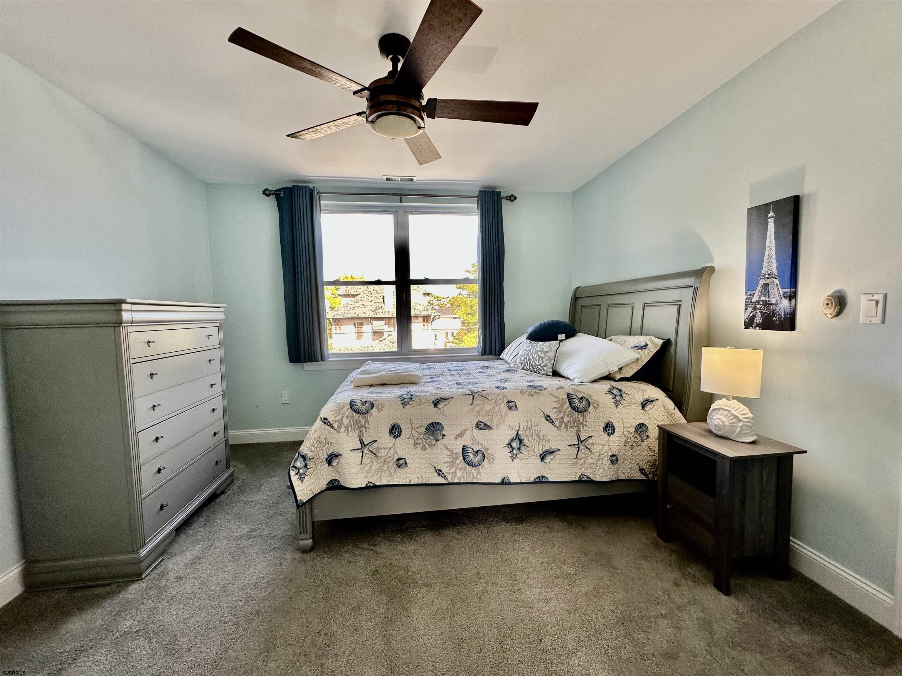 201 19th Street South Brigantine, NJ 08203 - Photo 17 of 29 a bed sitting in a bedroom next to a window