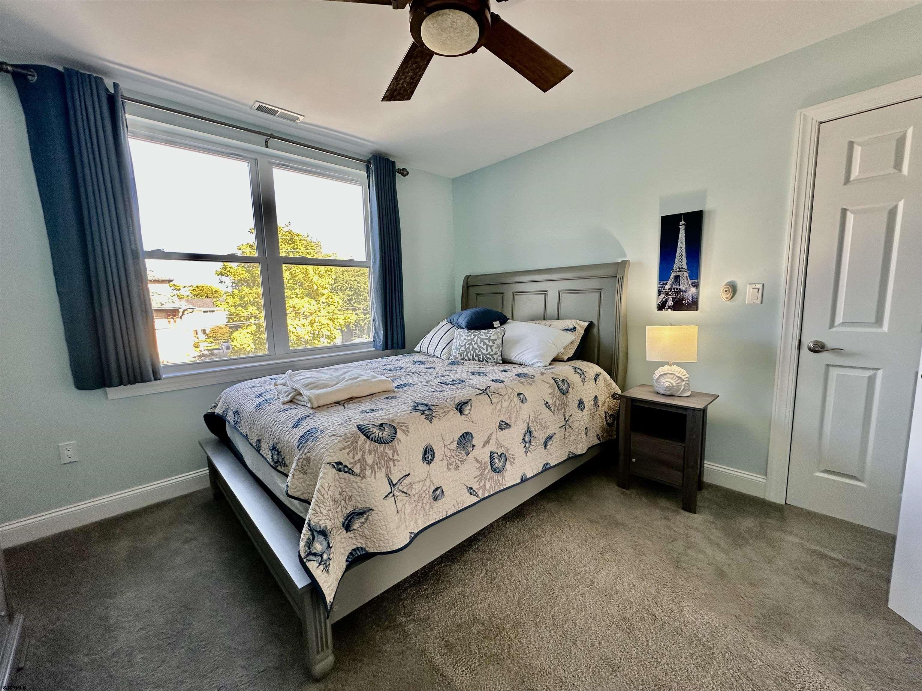 201 19th Street South Brigantine, NJ 08203 - Photo 18 of 29 a bedroom with a bed and window