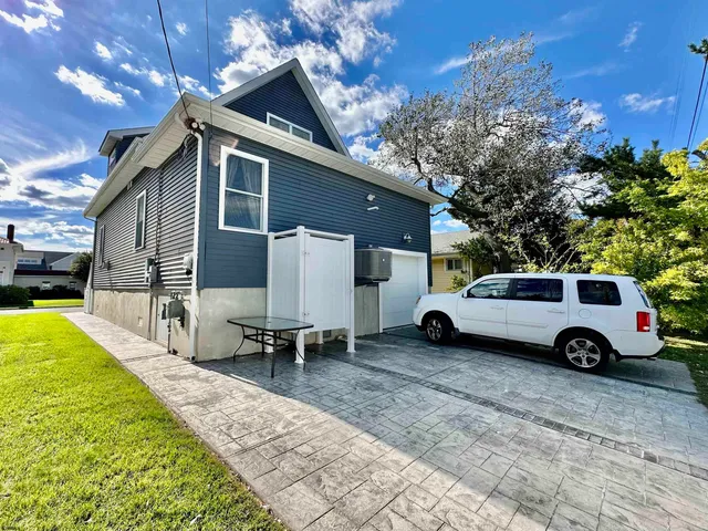 a view of a car parked in front of a house