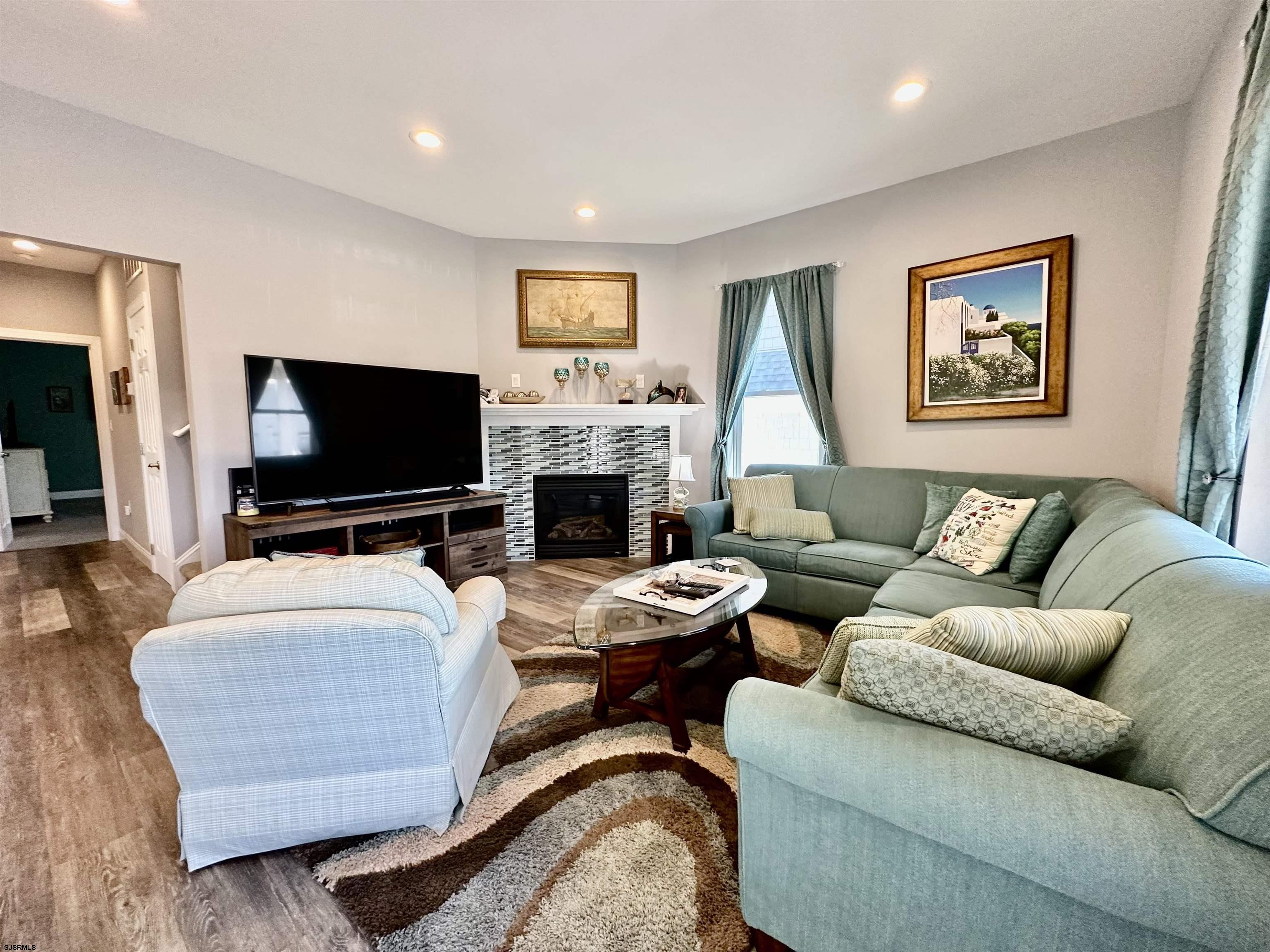 201 19th Street South Brigantine, NJ 08203 - Photo 4 of 29 a living room with furniture and a flat screen tv