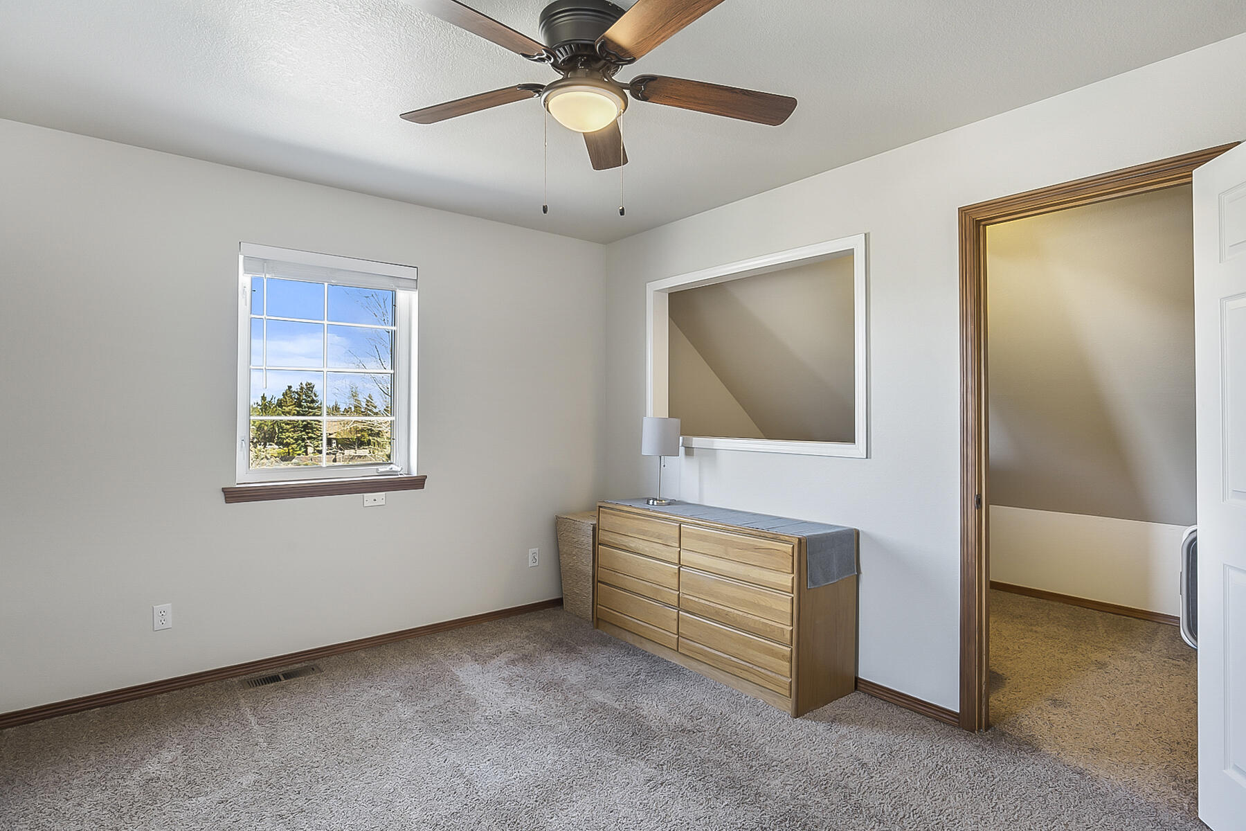 61030 Jennings Road Bend, OR 97702 - Photo 29 of 76 a living room with furniture and a ceiling fan