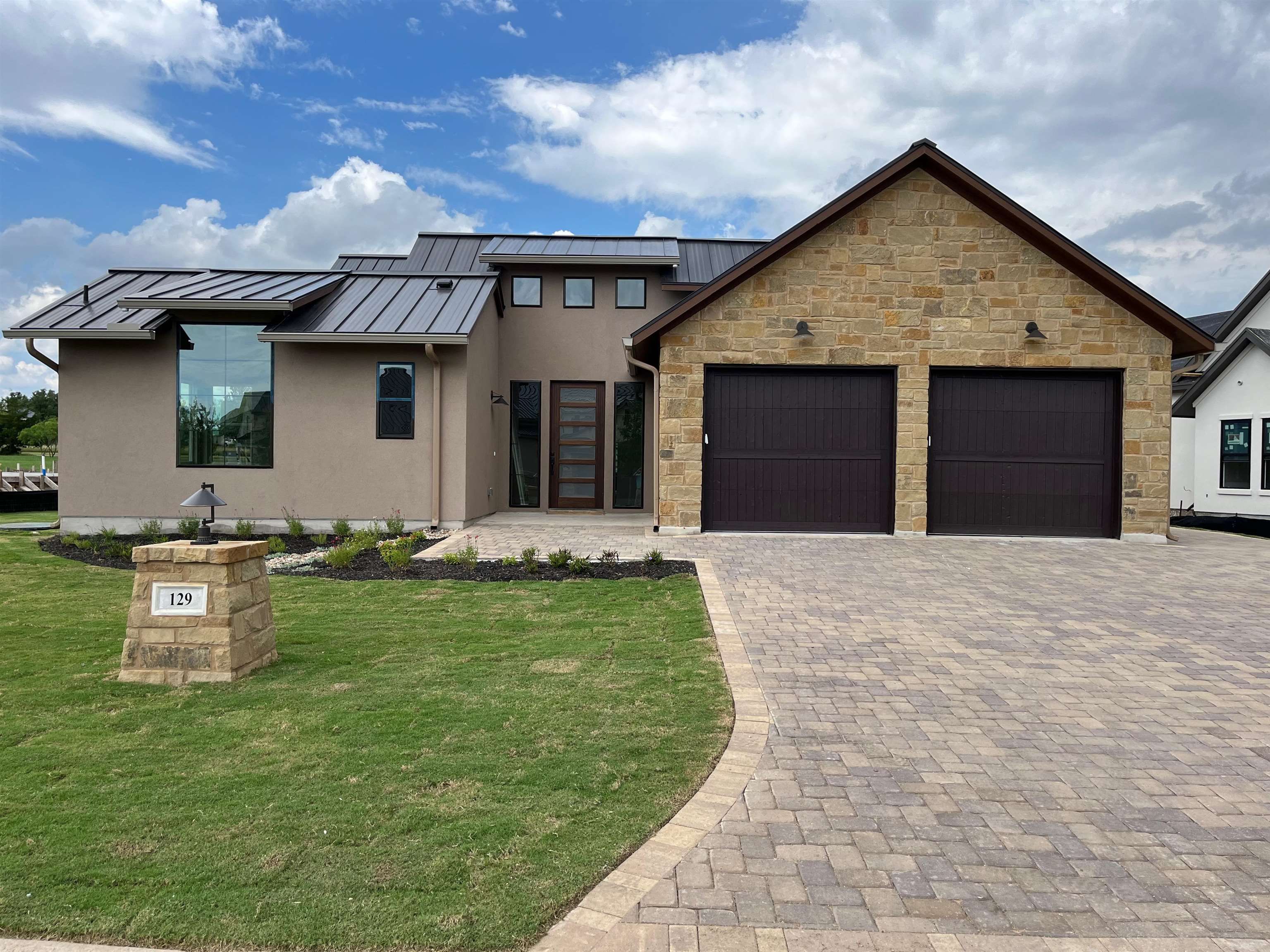 129 Azalea Loop Horseshoe Bay, TX 78657 - Photo 1 of 1 a front view of a house with a yard