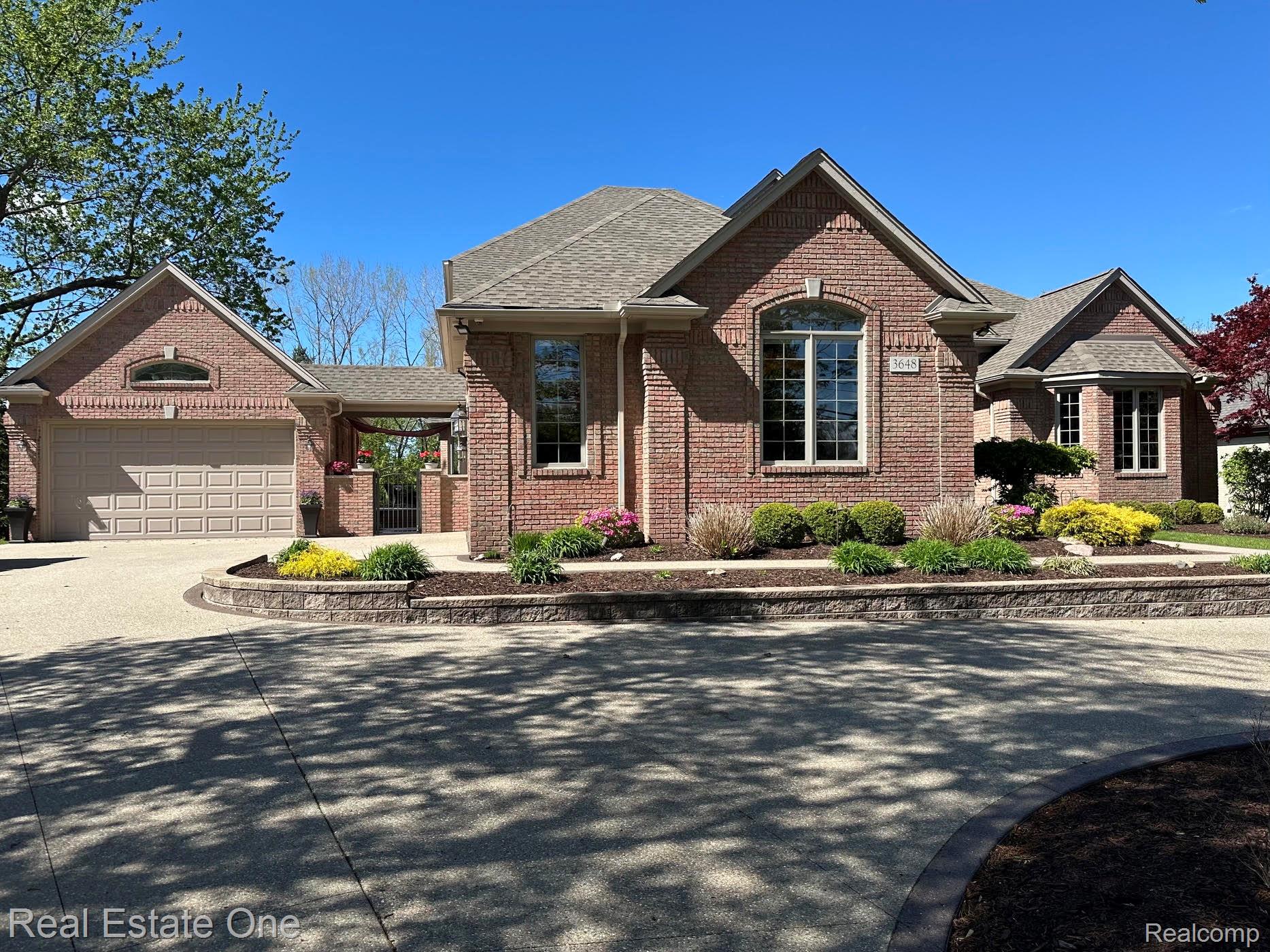 3648 West Tienken Road Rochester, MI 48306 - Photo 1 of 61 Beautiful Newer Exposed Aggregate Drive, Walkway and Steps with Colored Border.