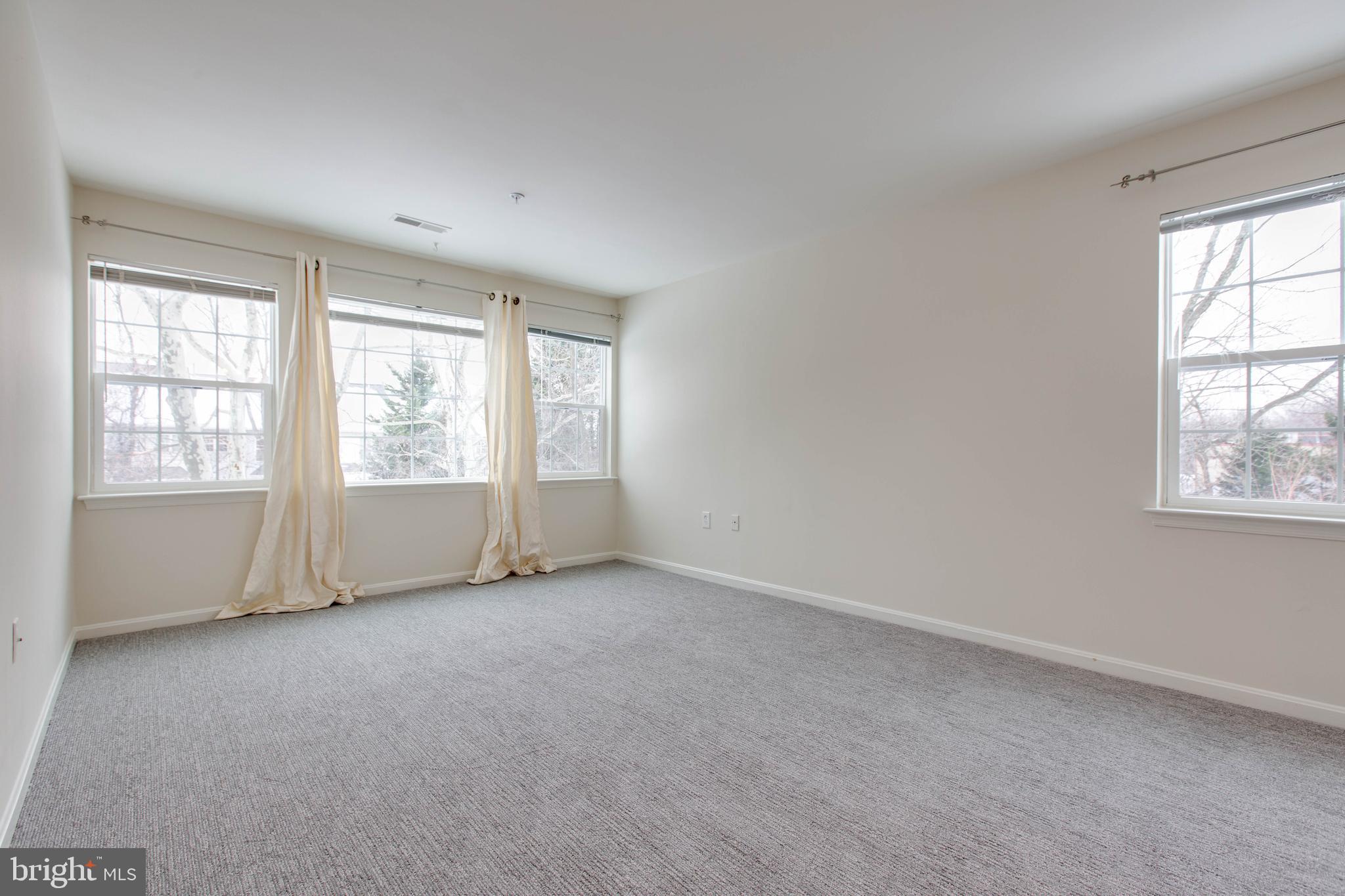 8399 Montgomery Run Road, Unit G Ellicott City, MD 21043 - Photo 16 of 31 an empty room with windows