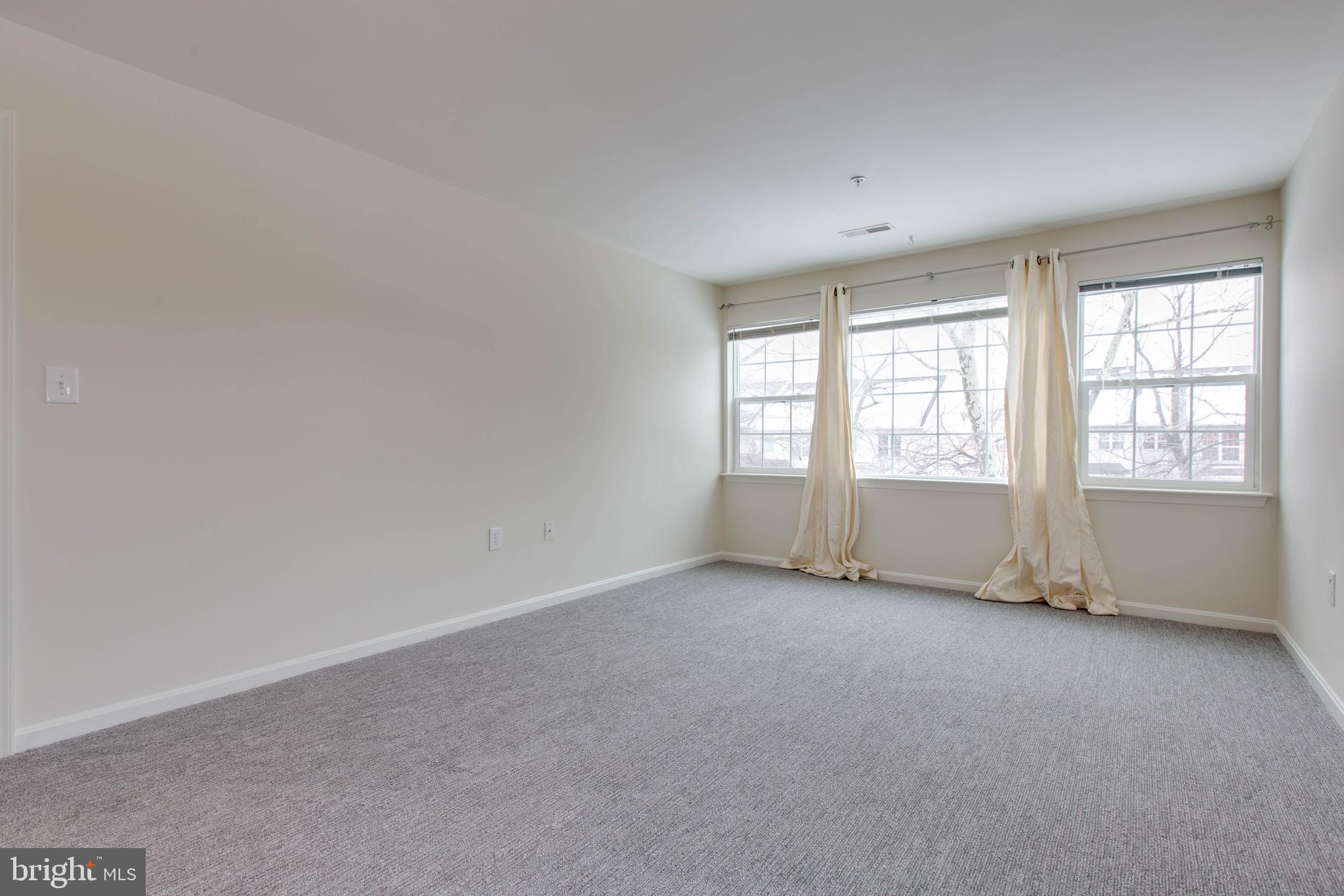 8399 Montgomery Run Road, Unit G Ellicott City, MD 21043 - Photo 17 of 31 an empty room with windows