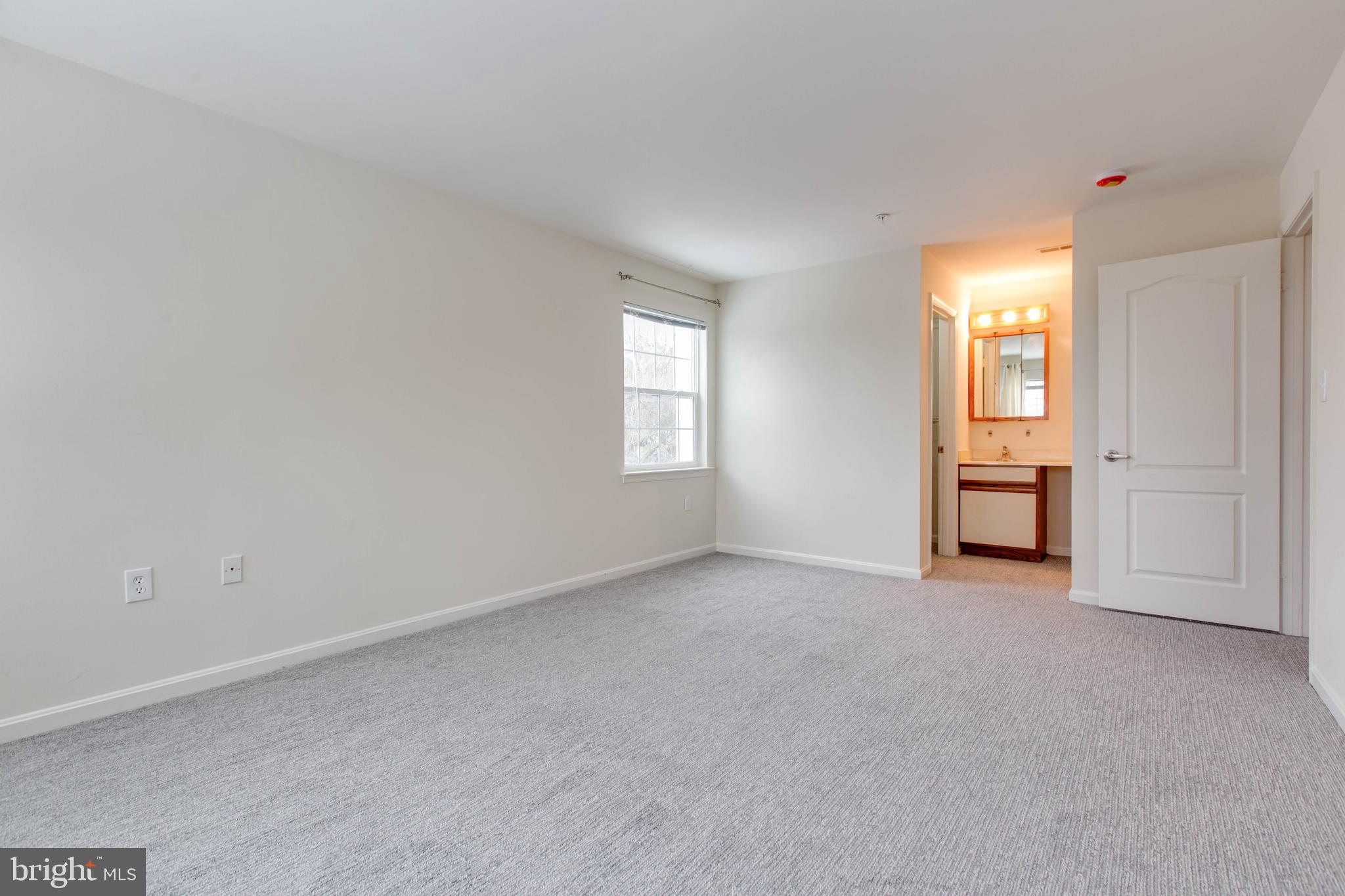 8399 Montgomery Run Road, Unit G Ellicott City, MD 21043 - Photo 19 of 31 an empty room with windows