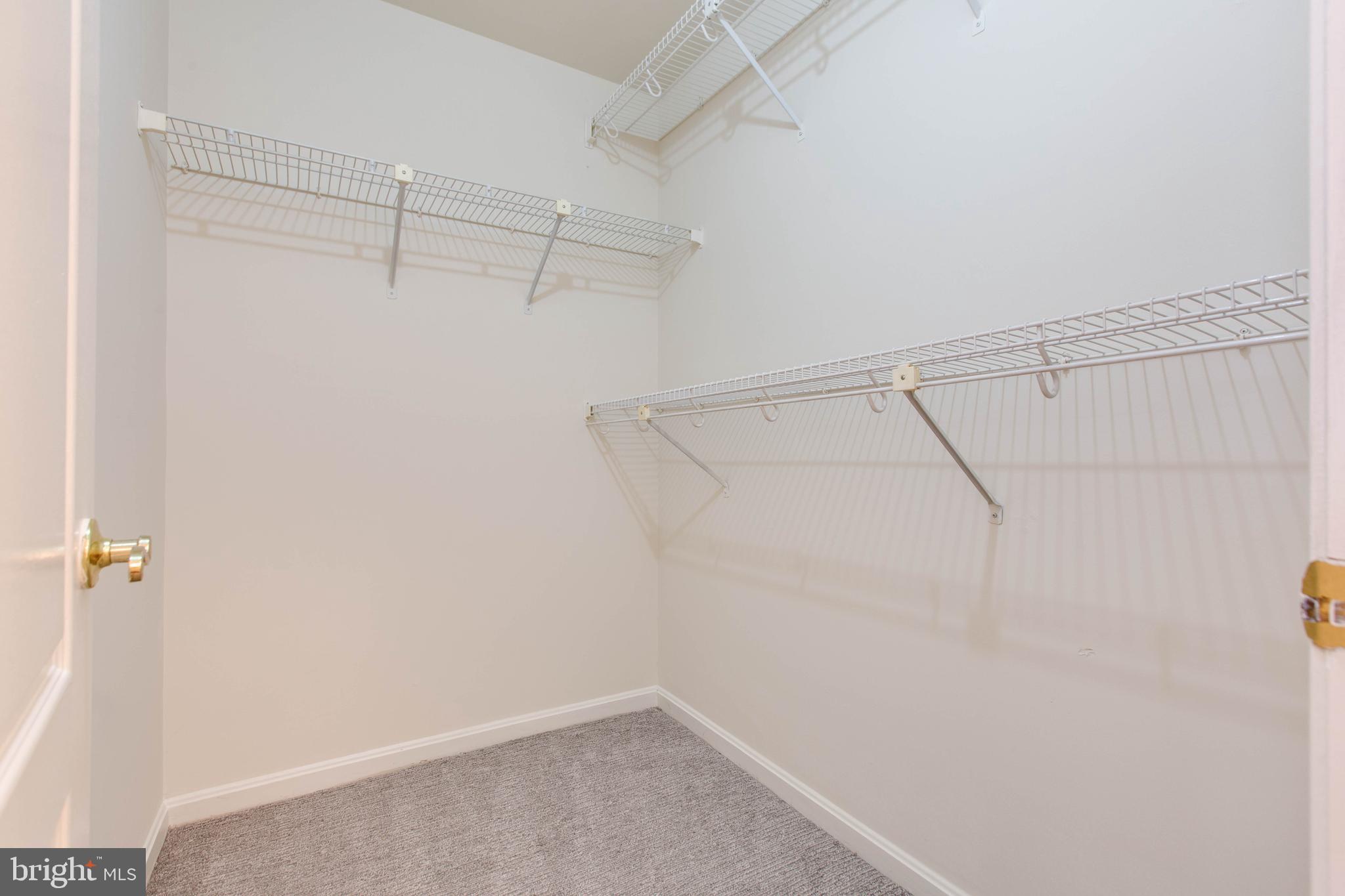 8399 Montgomery Run Road, Unit G Ellicott City, MD 21043 - Photo 21 of 31 a view of a room with racks on the wall
