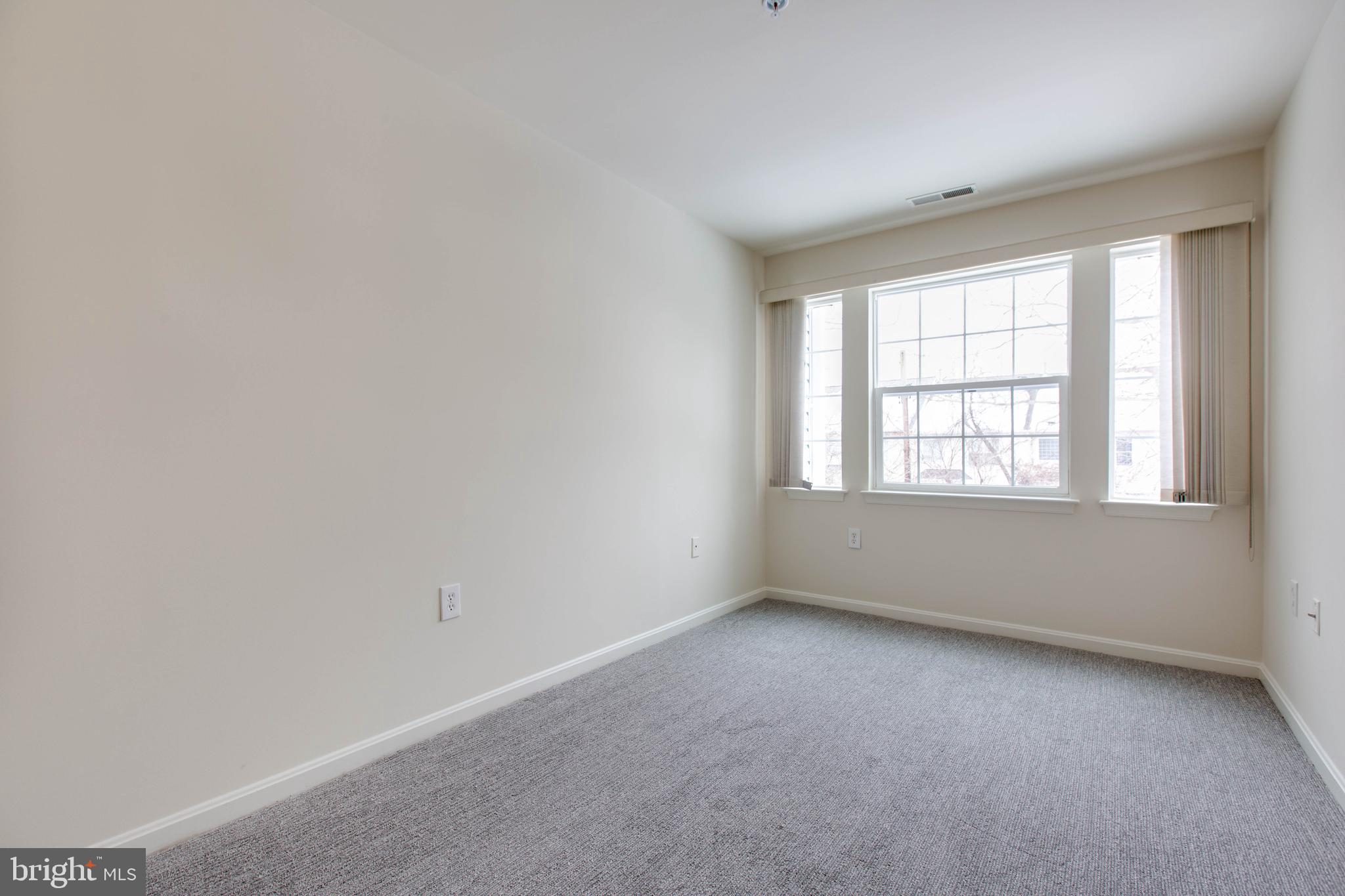 8399 Montgomery Run Road, Unit G Ellicott City, MD 21043 - Photo 22 of 31 an empty room with a window