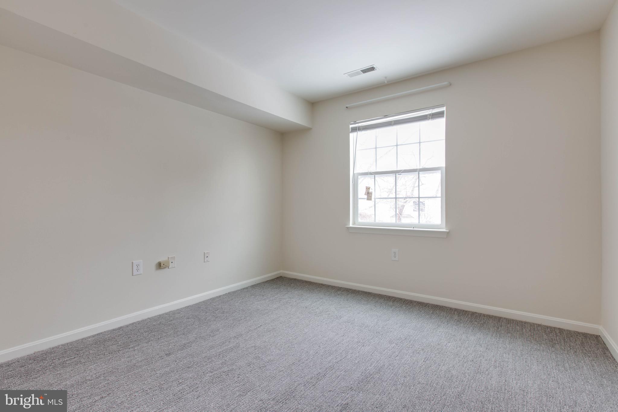 8399 Montgomery Run Road, Unit G Ellicott City, MD 21043 - Photo 26 of 31 an empty room with a window