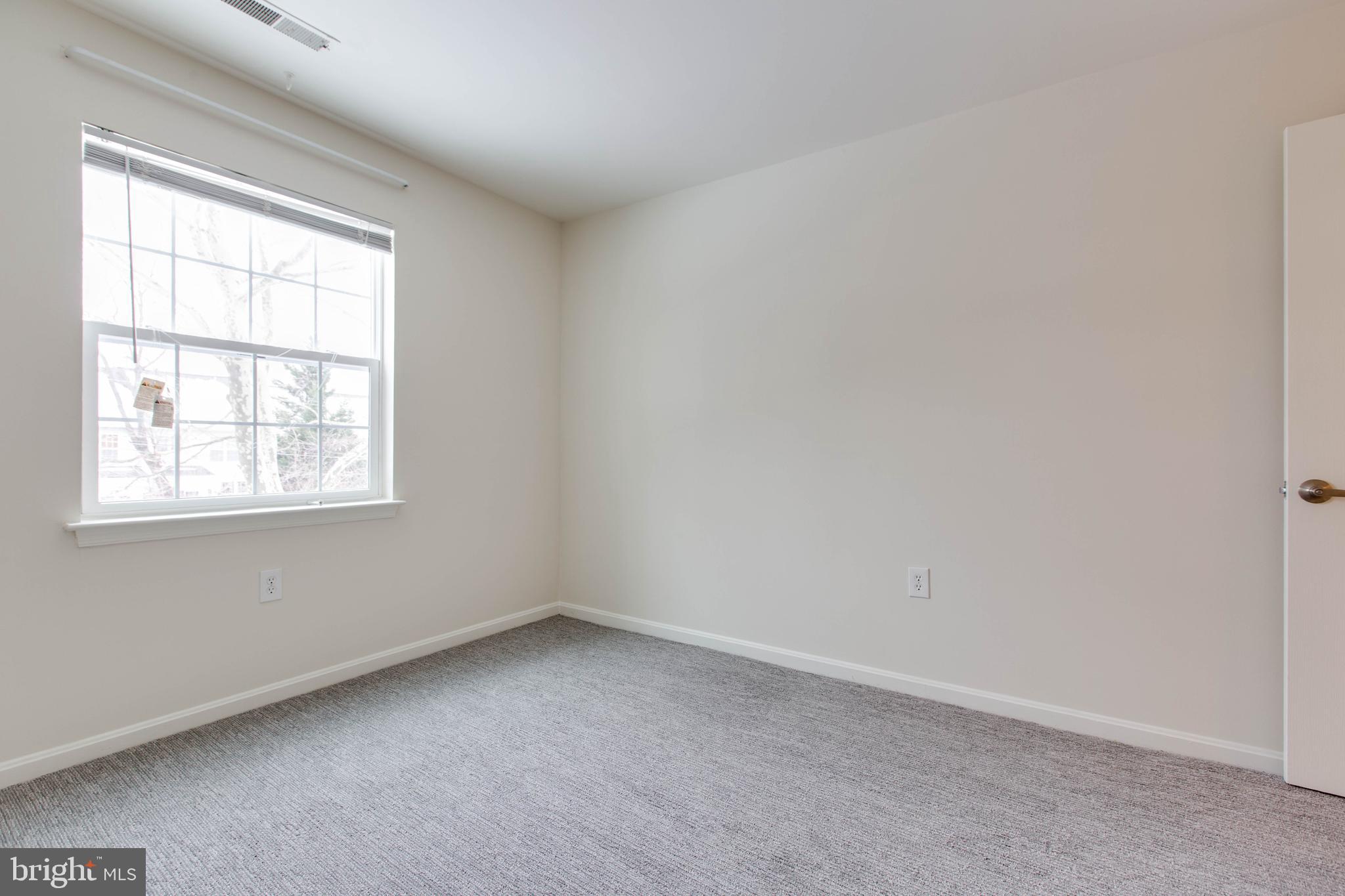 8399 Montgomery Run Road, Unit G Ellicott City, MD 21043 - Photo 27 of 31 an empty room with a window
