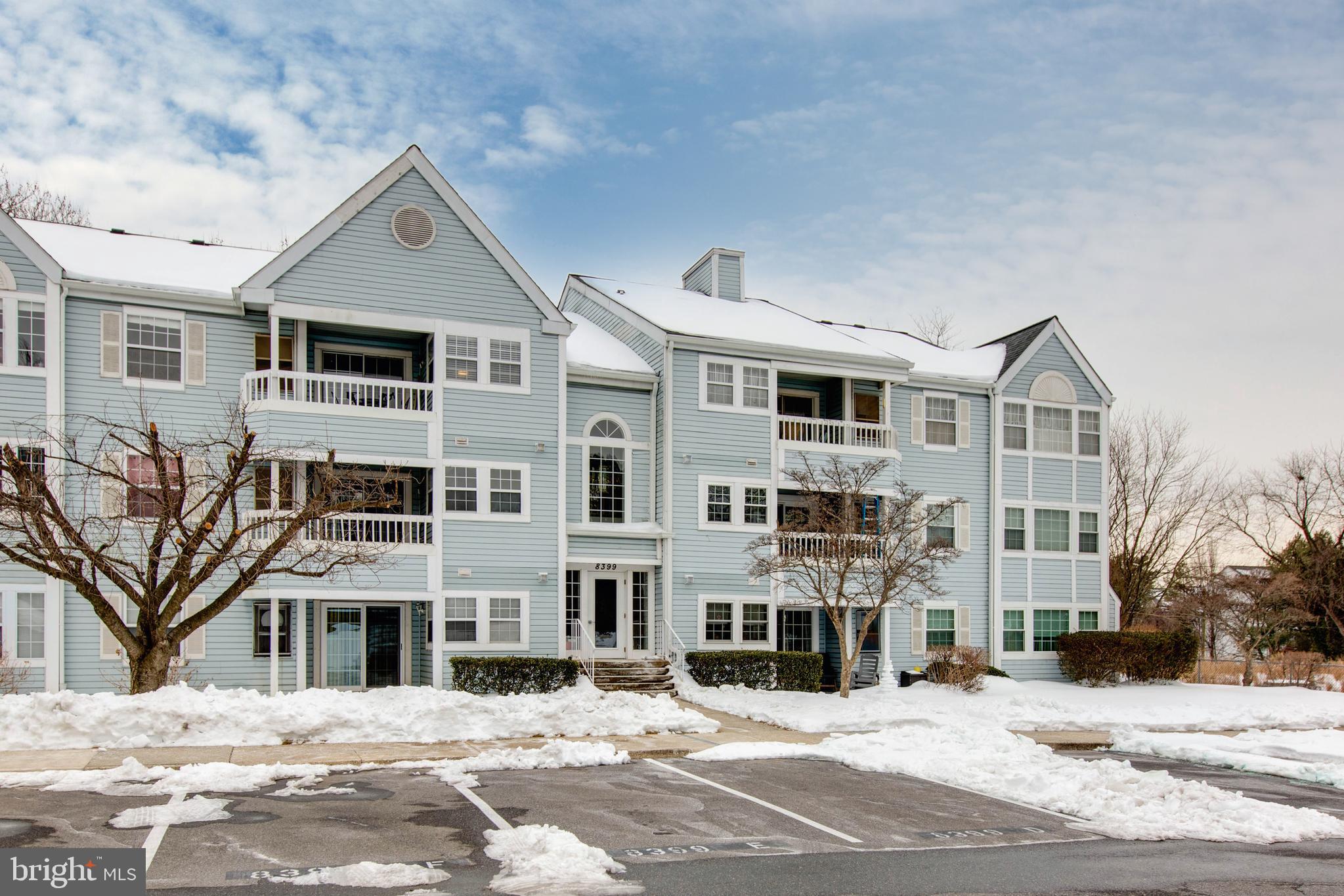 8399 Montgomery Run Road, Unit G Ellicott City, MD 21043 - Photo 3 of 31 a front view of a building with a road