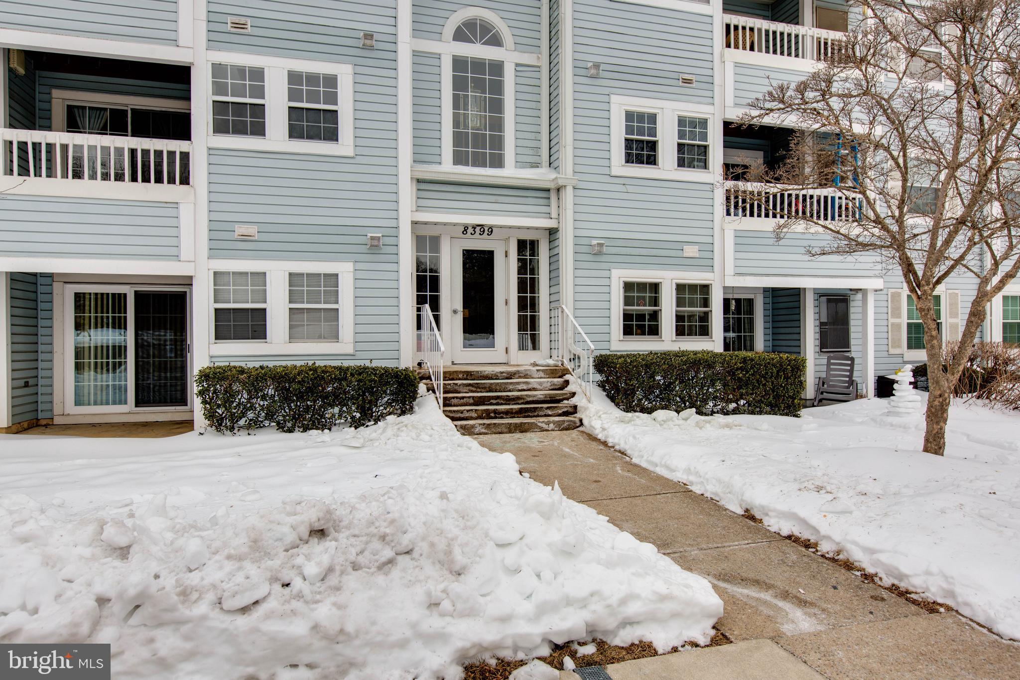 8399 Montgomery Run Road, Unit G Ellicott City, MD 21043 - Photo 4 of 31 a view of a house with a yard