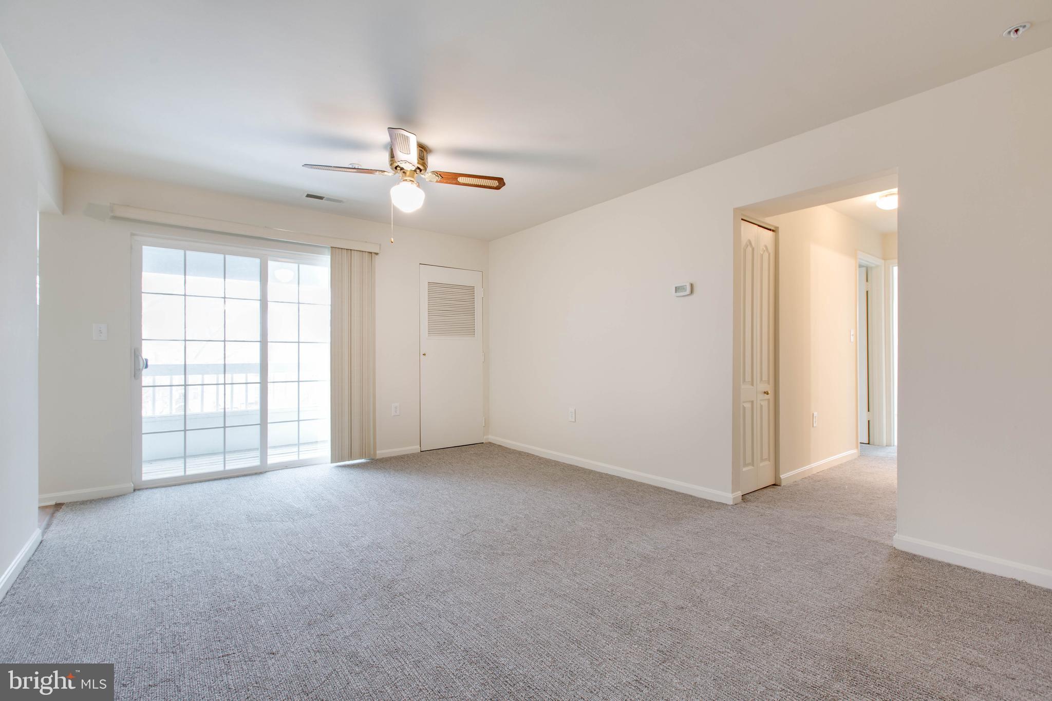 8399 Montgomery Run Road, Unit G Ellicott City, MD 21043 - Photo 8 of 31 an empty room with windows and fan