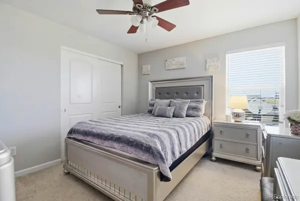 a bed room with a bed and a chandelier