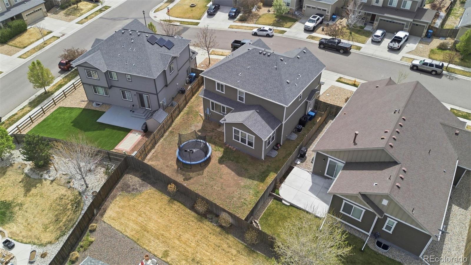 16343 East 100th Way Commerce City, CO 80022 - Photo 2 of 31 an aerial view of a house with a swimming pool