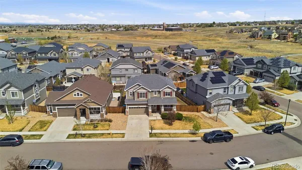 an aerial view of residential building with outdoor space and ocean view