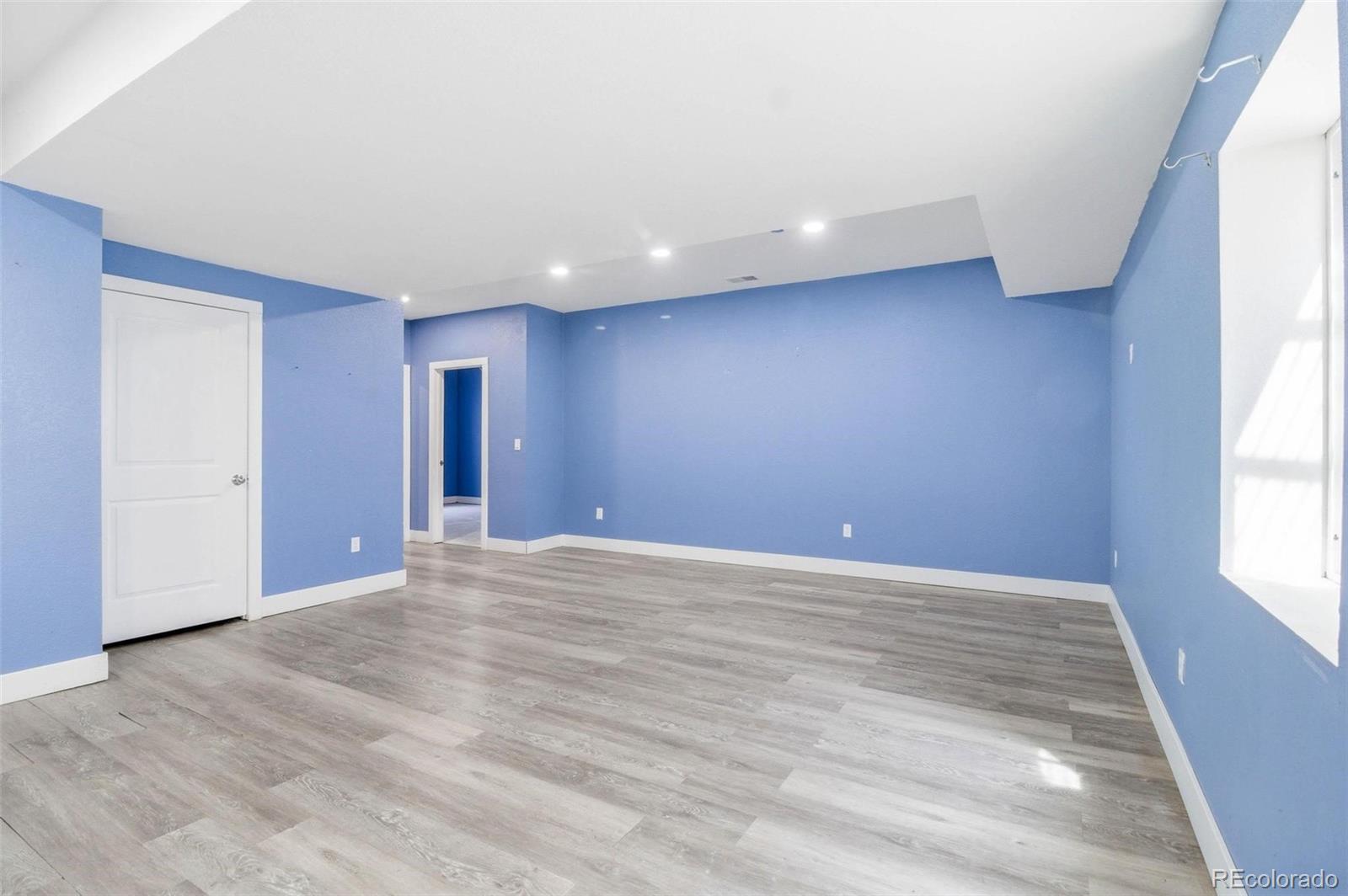 16343 East 100th Way Commerce City, CO 80022 - Photo 29 of 31 a view of an empty room and window