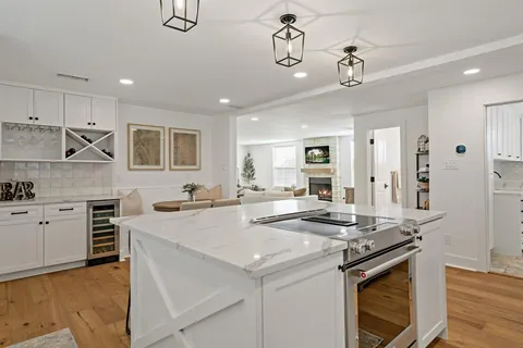 a kitchen with stainless steel appliances granite countertop a stove and a sink